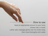 Hand applying soap with text on a gray backgroundClose-up of lightweight gel texture being applied to hand, illustrating how to use KUNDAL body wash for a luxurious self-care ritual.