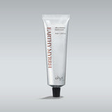 Tube of 'Crushed Cherry' hand cream on a gray background