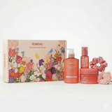 KUNDAL Protein Bonding Hair Care Gift Set featuring shampoo, hair mask, serum, and hair scrunchie in a floral gift box.